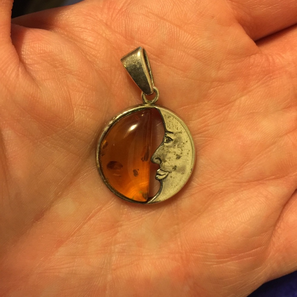Real amber & silver half moon pendant.